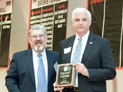 Andy McCreanor,UC Clermont Distinguished Alumnus receives plaque from Dean Jim McDonough.