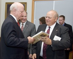Paul Bishop presents 'Ivory Tower' book to then-Secretary of Energy Bodman.