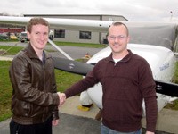 Justin Heitmeyer (right) with instructor Colin O'Rourke immediately following his solo flight.