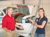 Sophie Gilgean (right) with instructor Keith Landrum immediately following her commercial checkride.