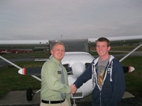 Jared Holthaus (right) with instructor Jimmy McCord immediately following his solo flight.