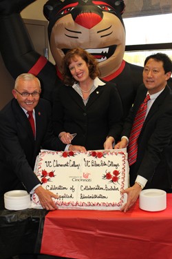UC Clermont Dean Greg Sojka, UC Blue Ash Dean Cady Short-Thompson and UC Provost Santa Ono join in the celebration of new collaborative bachelorÂ s degree program.