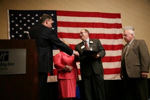 Ed Bridgeman accepts William H. Over Leadership Award at Clermont Chamber banquet.