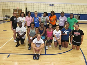 Photo was taken in the gym at Clark Montessori in Hyde Park with both UC Clermont and Clark Montessori volleyball players.