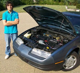 Ben Zavala and the electric vehicle he built.