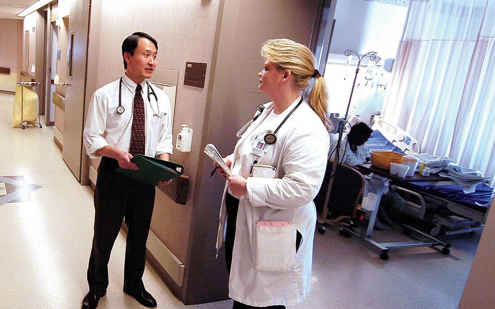 Michael Yi, MD, with medical resident Angela Brittsan, MD