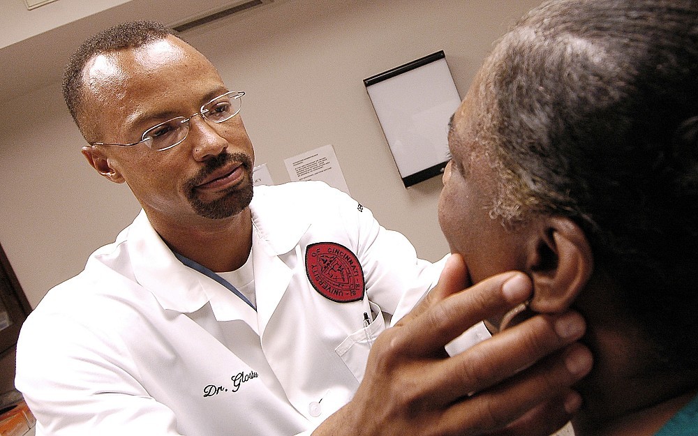 Dermatologist Hugh Gloster, MD, examines a patient for any signs of skin cancer. 