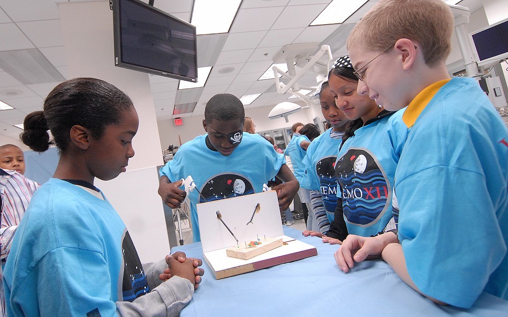 Students from Schroder Junior High compete in the NEEMO 12 robotics competition at UC. 