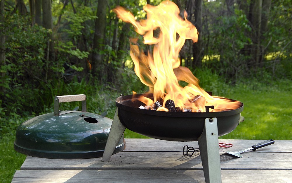 When charcoal grilling, wait several minutes after spraying charcoal with lighter fluid to ignite the coals. This allows explosive vapors to dissipate.