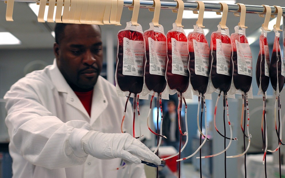 A technician evaluates donated blood in a Hoxworth Blood Center lab.