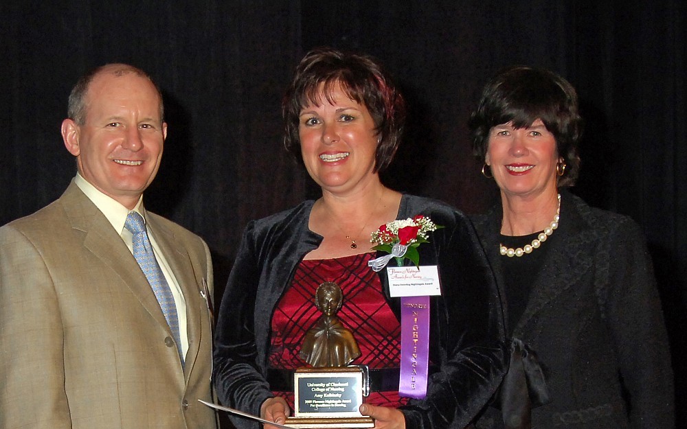 Diana Deimling (middle), a University Hospital Air Care and Mobile Care nurse, was presented a 2009 Nigthtingale Award. She is pictured here with Derek van Amerongen, MD, and Shannon Carter, both members of the UC College of Nursing Board of Advisors. 