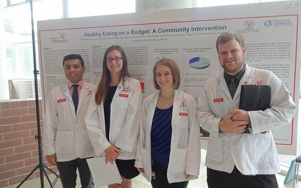 First-year medical students Zihan Masood, Eileen Wanamaker, Seth Reighard and Hannelore Geeraert with their service learning poster.