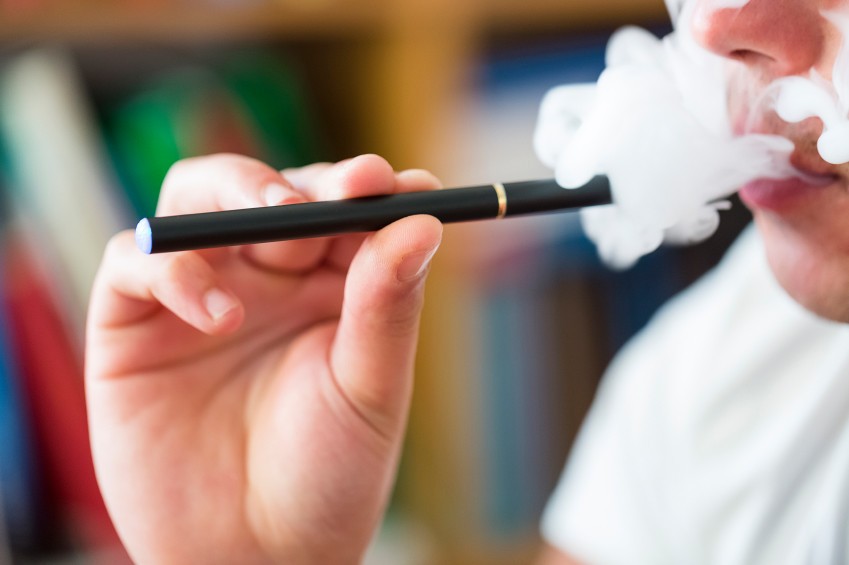 E-cigarettes emit a vapor that contains nicotine.