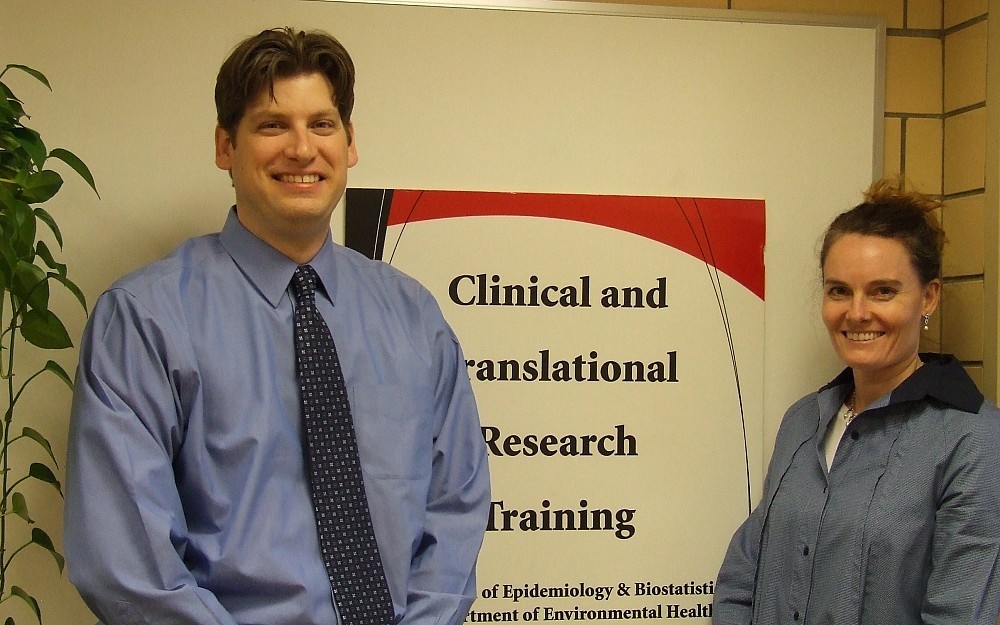 Bryce Robinson. MD, associate professor in UCÂ s Department of Surgery and spring graduate of the MS program, with Erin Haynes, DrPH,associate professor and Director of the CTR Training Program.