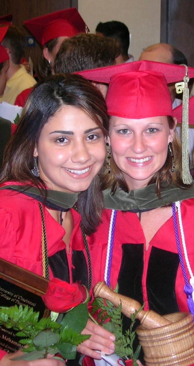 Pharmacy Alumnae Dina Kennedy Mohammad, PharmD, (left) and Christy Griffith Mulberry, PharmD, (1981-2013) at their pharmacy hooding 05'. 