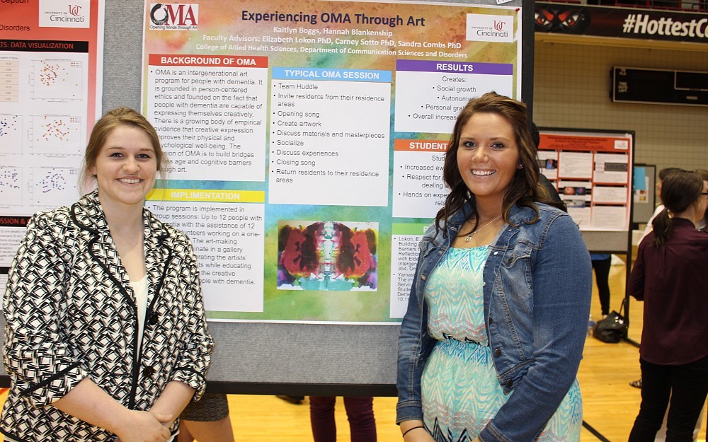CAHS students Kaitlyn Boggs and Hannah Blankenship in front of their PRaISE poster in 2015