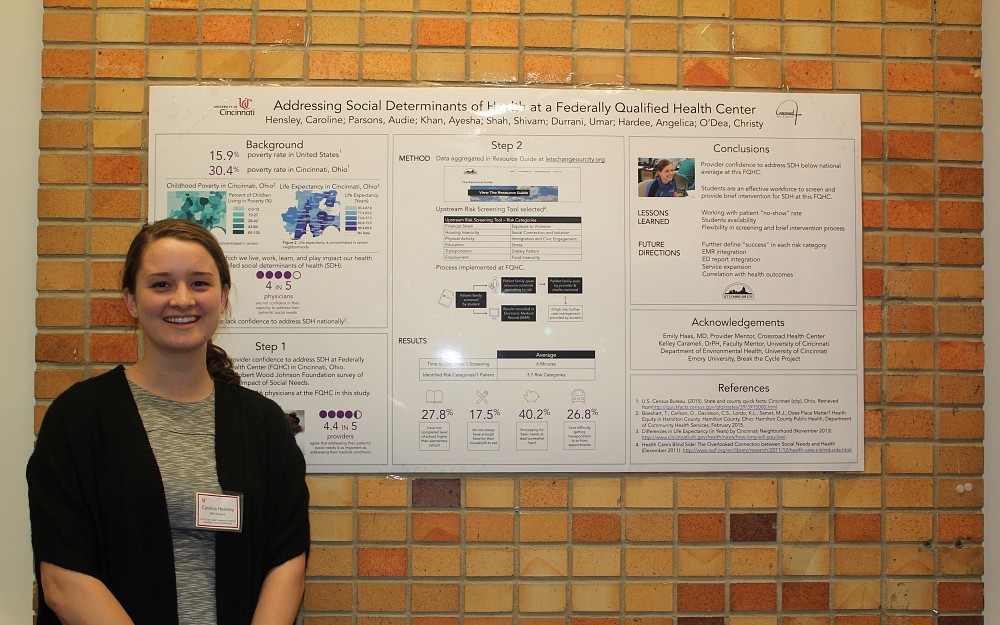 Caroline Hensley, UC MPH student, shows off her work with the Crossroad Health Center