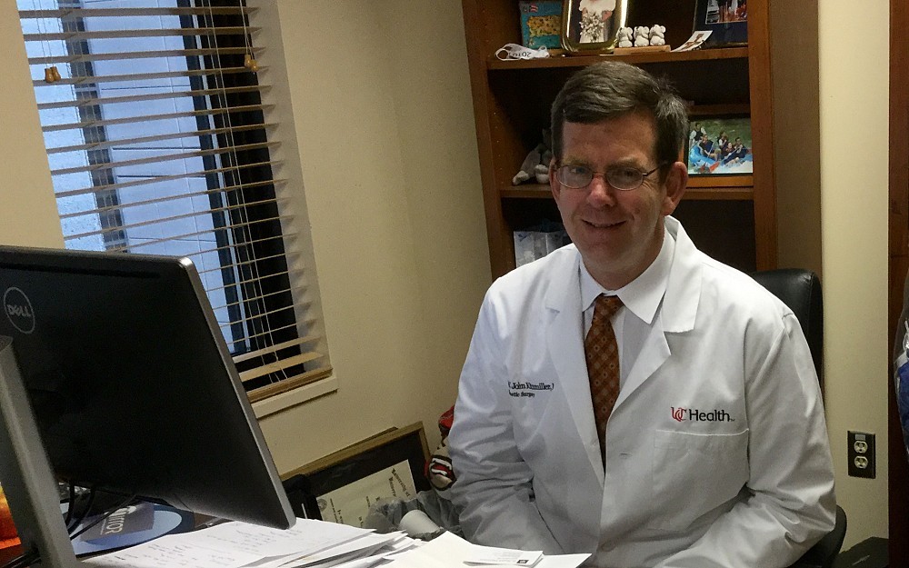 John Kitzmiller, MD, chief of plastic, reconstructive and hand surgery at UC in his office in the College of Medicine