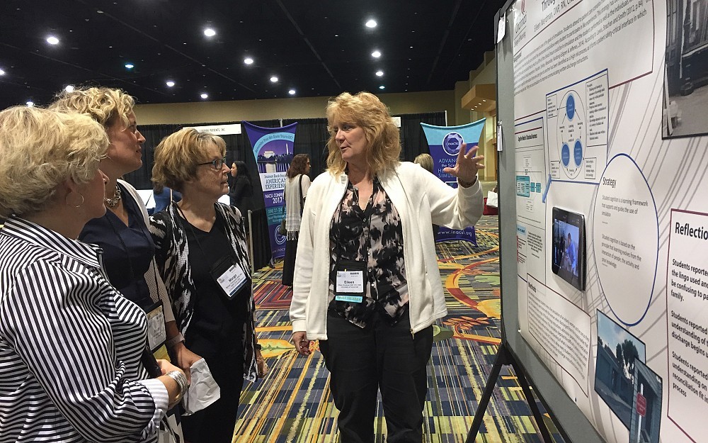 Eileen Werdman, center, assistant professor of clinical, UC College of Nursing, with a poster presentation at the National League for Nursing Education Summit, Sept. 22, 2016