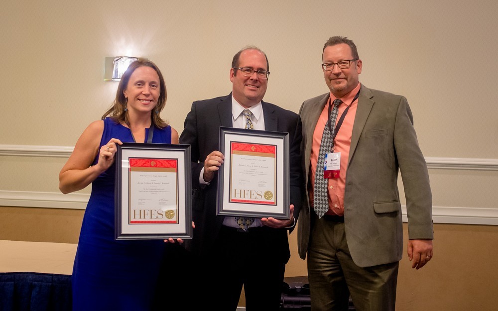 Susan Kotowski, PhD, assistant professor in the College of Allied Health Sciences, and Kermit Davis, PhD, associate professor in the Department of Environmental Health with Peter Johnson the chair of the HFES Awards Committee, presenting their awards at the HFES International Annual Meeting, Sept. 23, 2016